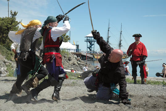 Pirates Fighting Among Themselves While the Spanish Galleon Sails On Up