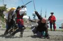 Pirates Fighting Among Themselves While the Spanish Galleon Sails On Up